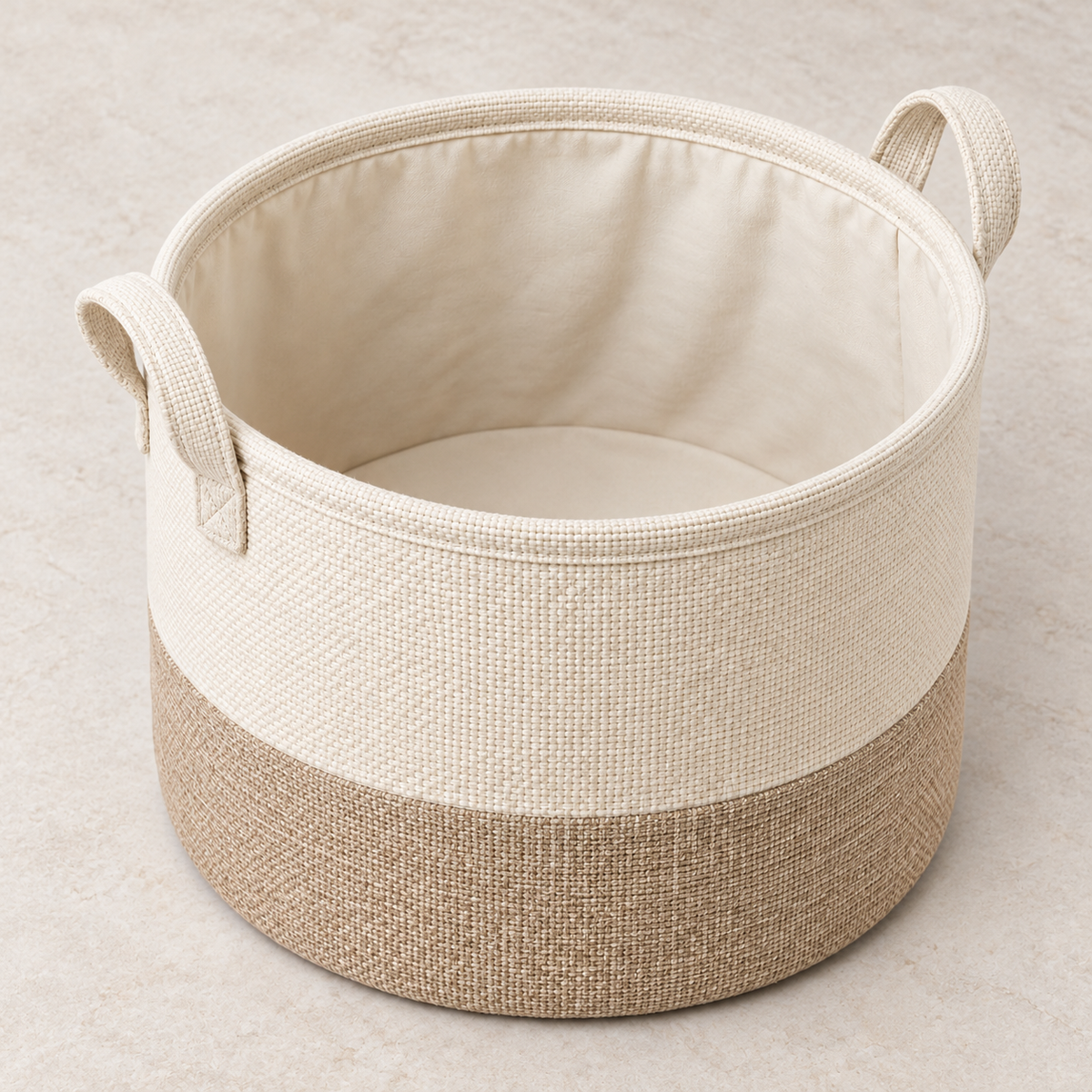 Soft Sand Small Round Fabric Storage Basket showing fabric handles and open interior
