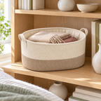 Soft Sand Wide Oval Fabric Storage Basket in a home storage setting